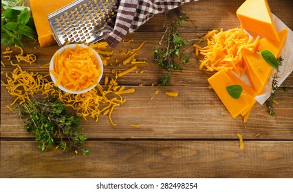 Cheddar Cheese On  Rustic Wooden Background. Top View