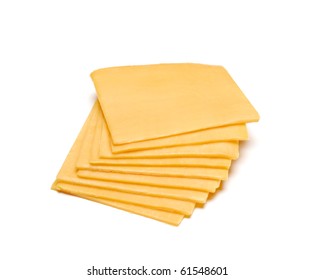 Cheddar Cheese Slices On White Background.