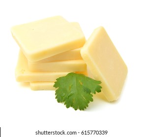 Cheddar Cheese Slices On White Background. 
