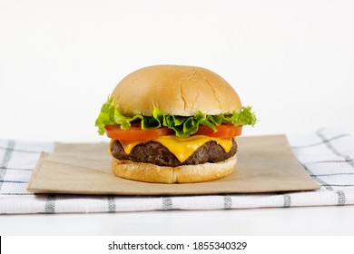 cheddar cheeseburger with tomato and lettuce - Powered by Shutterstock