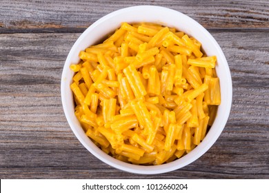 Cheddar Mac And Cheese Bowl Over Rustic Wooden Table