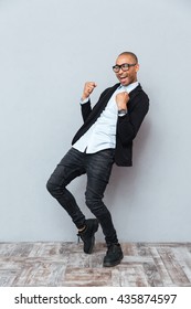 Cheeful African American Young Man Celebrating Success