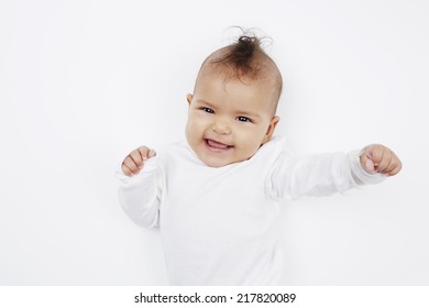 Cheeky Baby Girl With Mohican Hairstyle In Baby Gro 