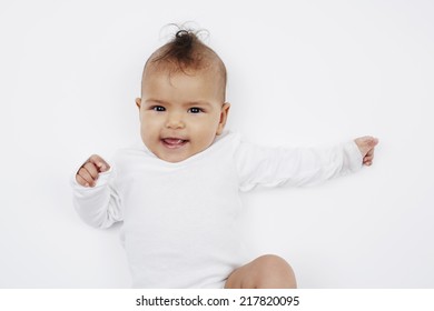 Cheeky Baby Girl With Mohican Hairstyle In Baby Gro 