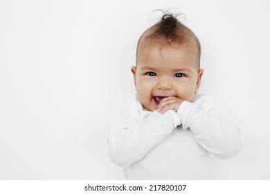 Cheeky Baby Girl With Mohican Hairstyle In Baby Gro 