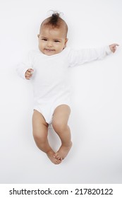 Cheeky Baby Girl With Mohican Hairstyle In Baby Gro 