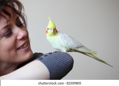 Cheeky Cockatiel Parrot And Woman