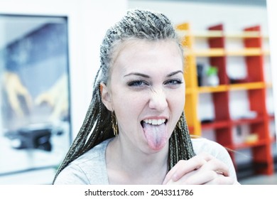 Cheeky Girl Sticks Out Her Tongue At Her Workplace