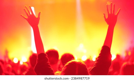 Cheer woman fan hang out. Fun girl enjoy music concert. Epic neon glow light party. Cool dj live show. People clap night club hip hop fest. K pop event applaud. Joy rock roll rave. Teen raise hand up. - Powered by Shutterstock