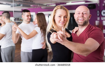 Cheerful Adult Couples Enjoying Of Partner Dance And Smiling