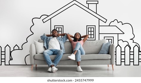 Cheerful African American couple sitting on couch with hand-drawn house backdrop behind them, sharing a vision of home, real estate concept - Powered by Shutterstock