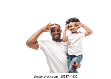 Cheerful African American Father Holding Son Imitating Photo Shooting Isolated On White