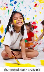 A Cheerful African American Girl Painting