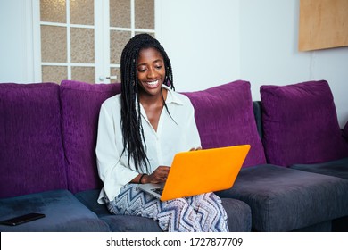 Cheerful African American Woman In Casual Wear Satisfied With Online Delivery Service Browse Web Page On Laptop Computer Shopping On Web Store, Smiling Dark Skinned Female Laughing At Funny Video