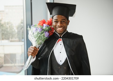 Cheerful African Male Graduate Holding His Diploma