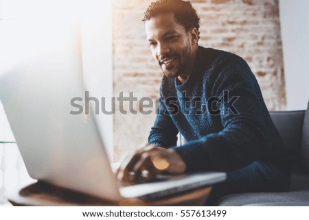 Similar – Image, Stock Photo Cheerful ethnic man using credit card and smartphone
