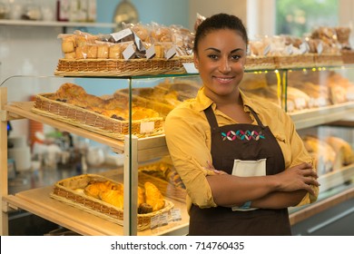 Cheerful African Mature Woman Smiling Joyfully Posing Proudly With Her Arms Folded At Her Bakery Store Copyspace Baker Job Occupation Businesswoman Salesperson Retailer Professional Confidence Success