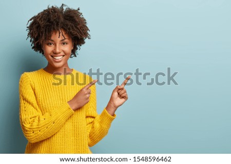 Similar – Image, Stock Photo Woman hand pointing with index finger over black