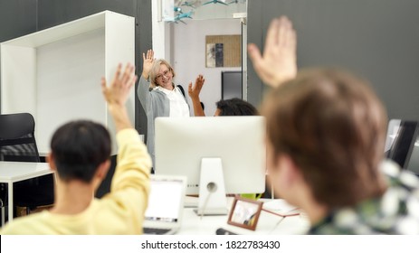 Cheerful Aged Woman, Senior Intern Waving, Saying Goodbye To Her Young Colleagues While Leaving Office After First Day At Work, Selective Focus, Web Banner