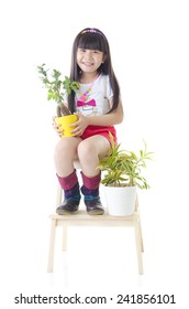 Cheerful Asian Kid Holding Pot Plant