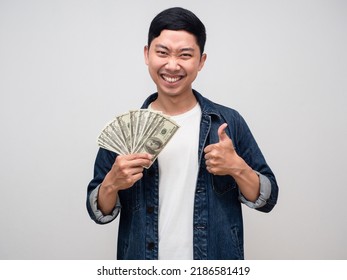 Cheerful Asian Man Jeans Shirt Gentle Smile Earn Money In Hand And Thumb Up Isolated