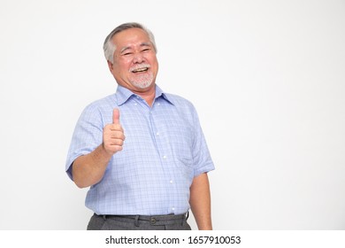 Cheerful Asian Senior Man Giving A Thumb Up And Looking At The Camera Isolated On White Background