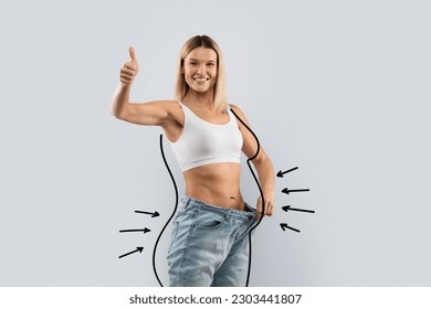 Cheerful attractive slim middle aged blonde woman wear huge jeans, showing thumb up, demonstrate results of diet, black body shape lines around well-fit lady, collage for slimming concept, copy space
