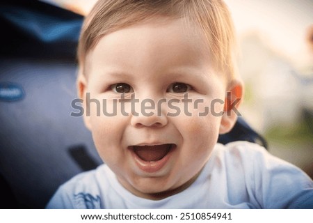 Similar – Image, Stock Photo Little cute boy looking at camera and sticking out his tongue