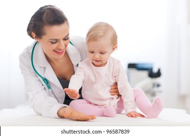 Cheerful Baby High Five To Pediatrician Doctor