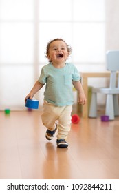 Cheerful Baby Toddler Running In Children Room