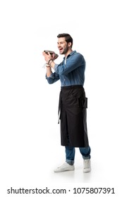 Cheerful Bartender In Apron With Shaker In Hands Isolated On White