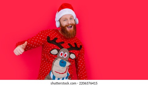 Cheerful Bearded Man Celebrate Christmas With Music. Man In Headphones Listen Christmas Music