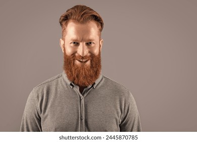 cheerful bearded man has beard. bearded man with long beard isolated on grey background