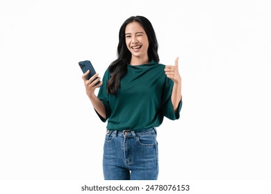 Cheerful beautiful Asian woman holding smartphone with shows like sign on white background.