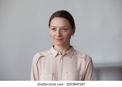 Cheerful beautiful female clear fresh perfect skin spending time at home close up portrait. Pleasant modern Caucasian feminine person with happy face expression smile at domestic interior. Cute people