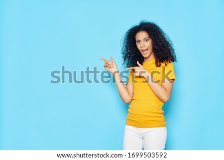 Cheerful beautiful woman curly hair lifestyle gesture with hands