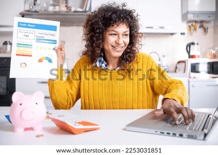 Cheerful black woman holding good credit score bank statement