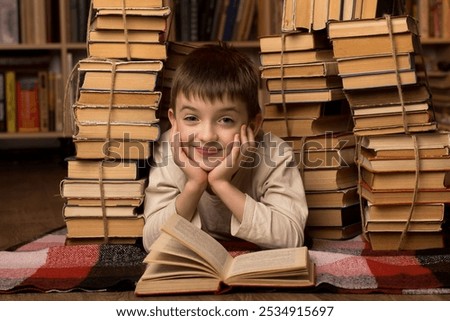 Similar – boy reading books