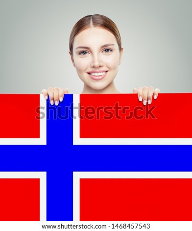 Cheerful brunette woman showing with the Norway flag background. Live, work, education and internship in Norway