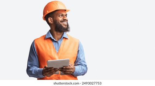 Cheerful Builder Holding Digital Tablet Smiling Looking Aside Posing On White Studio Background. Free Space, Panorama - Powered by Shutterstock