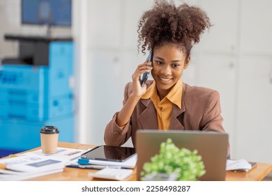 Cheerful business african american woman freelancer making telephone call share good news about project working in office workplace, business finance concept.