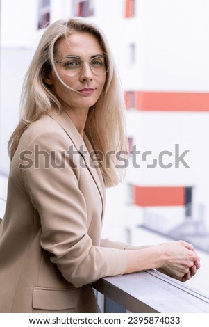 Similar – Young woman stiring coffee looking back