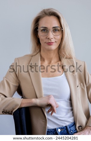 Similar – Young woman stiring coffee looking back