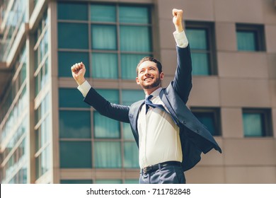 Cheerful Business Man Celebrating Success Outdoors