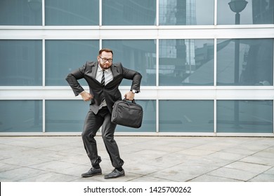 Cheerful Business Man Dancing Near The Office Building On The Street.