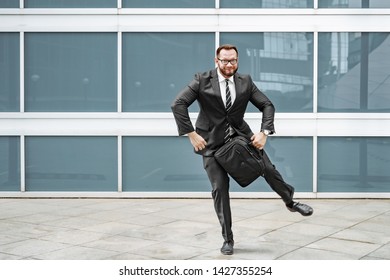 Cheerful Business Man Dancing Near The Office Building On The Street.