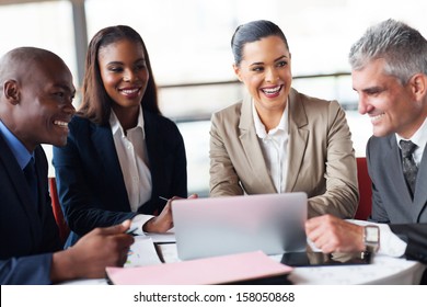 Cheerful Business People In A Meeting At Office