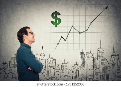Cheerful businessman looking optimistic at growing graph. Business analyst wearing eyeglasses makes future plans, gives prognosis on world economics. Increasing company income, financial concept. - Shutterstock ID 1731252358