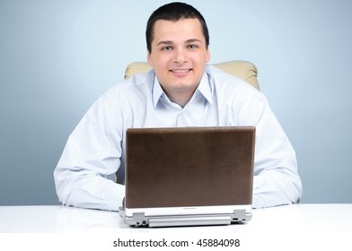 Cheerful businessman on blue background