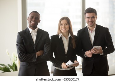 Cheerful Businesswoman In Formal Wear Standing Between Two Confident Businessmen Posing For Camera, Multi-ethnic Team Portrait, Motivated Professional Consultants, Board Of Directors, Business Group